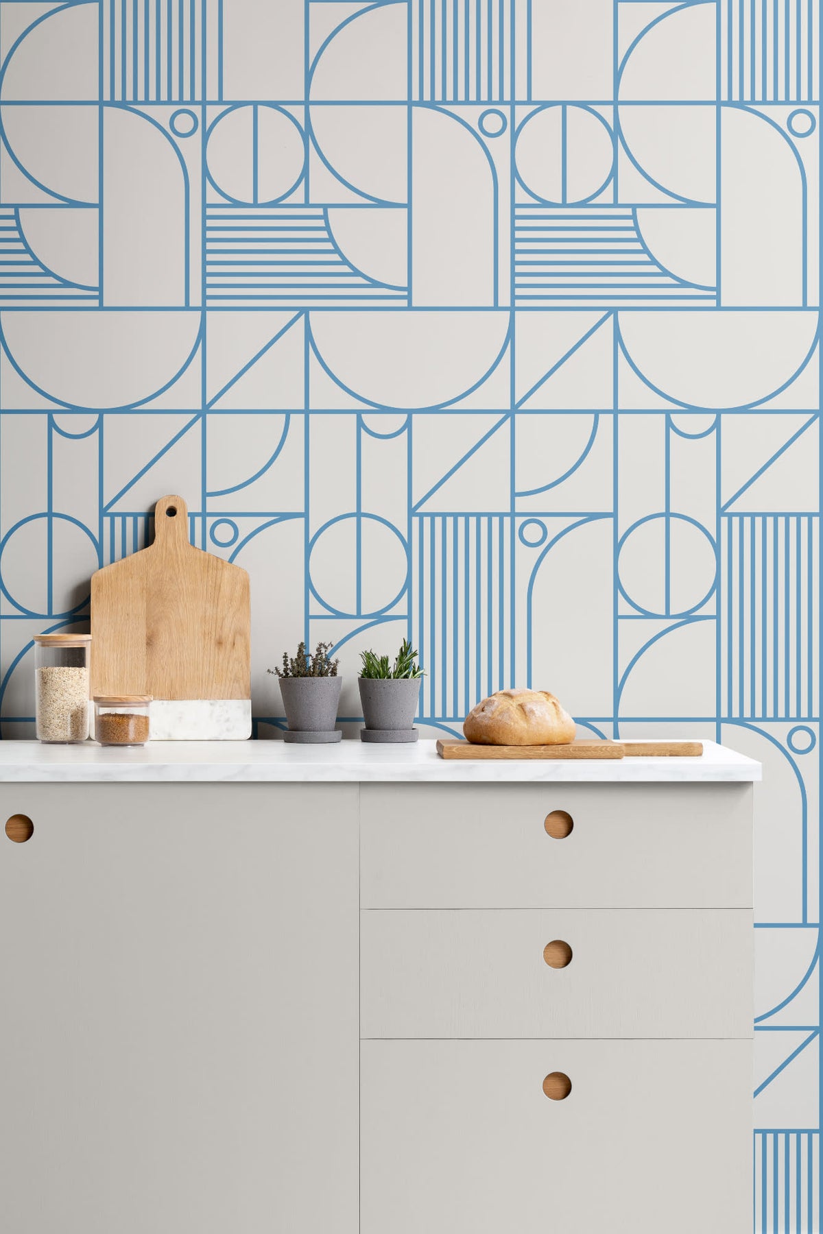 The Deco Blueprint wallpaper in azure blue in a kitchen