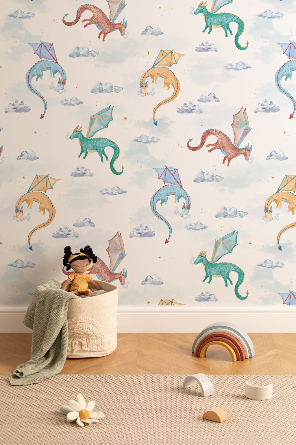 The Dragon Skies wallpaper in chalk white behind a kids' play corner