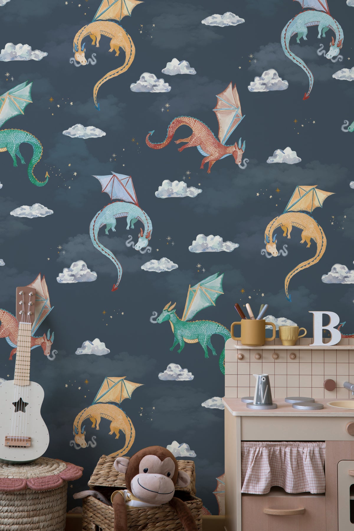 The Dragon Skies wallpaper in midnight navy behind a kids' play corner