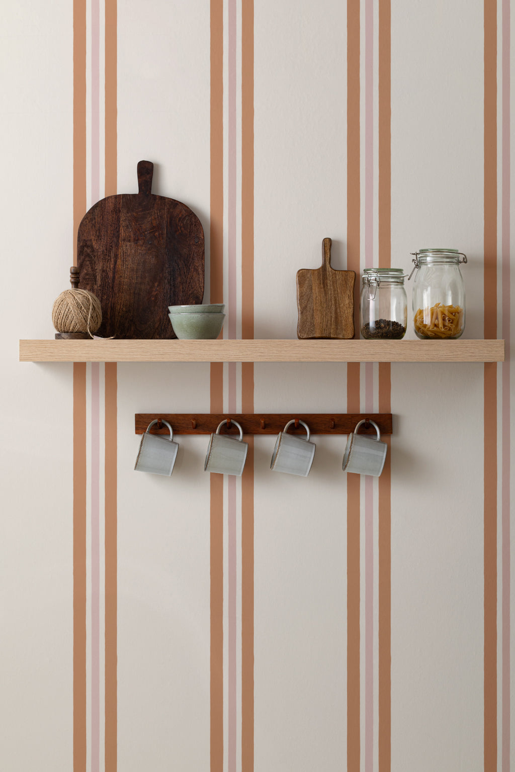 The Draughtsman Stripe wallpaper in burnt orange in a hallway