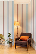 The Draughtsman Stripe wallpaper in sky blue in a living room