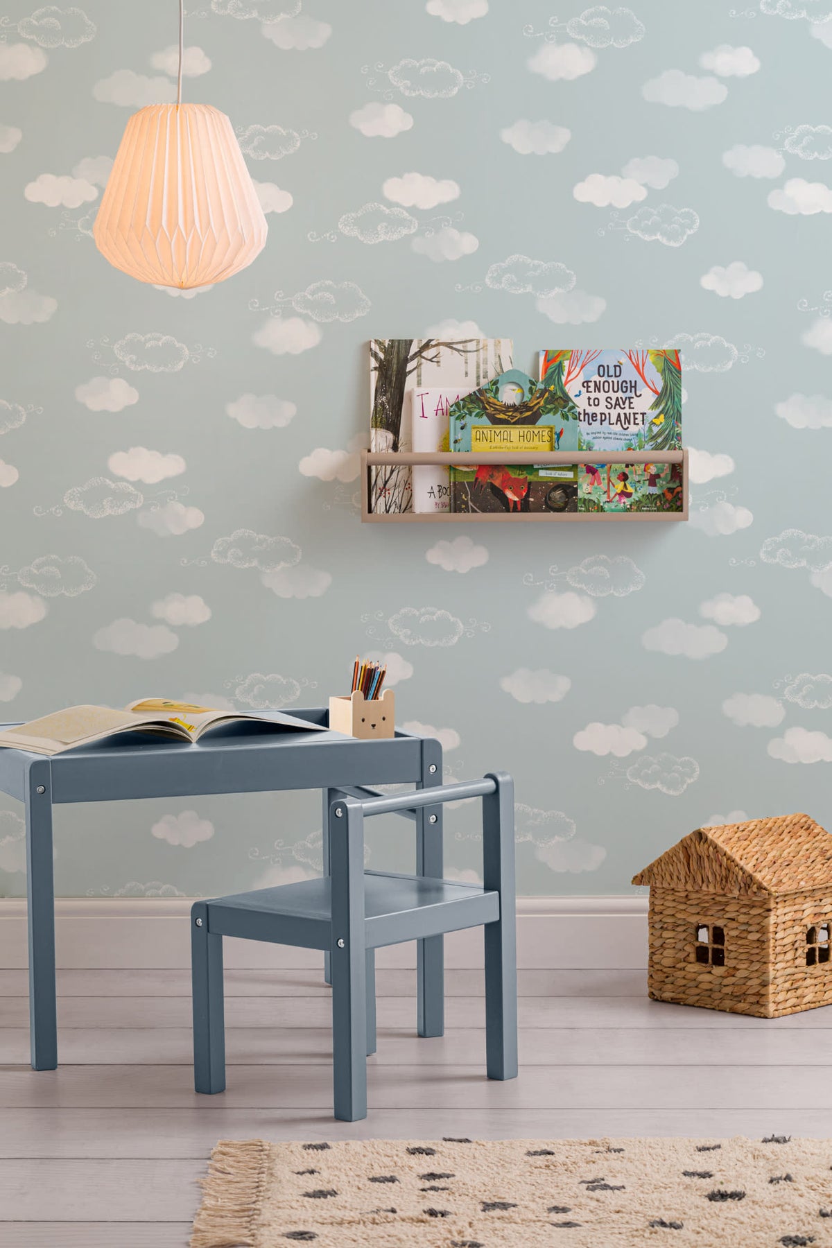 The Drifting Cloud wallpaper in pale sky blue in a child's bedroom