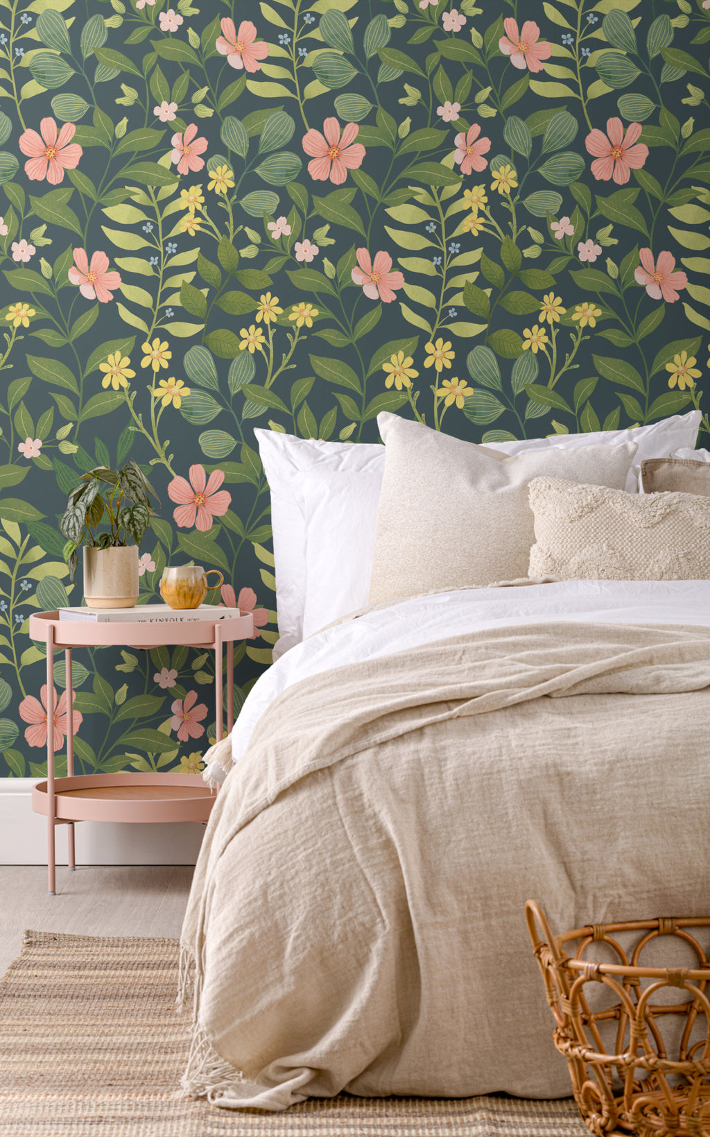 The Dusk Rosarium wallpaper in forest green and blush behind the bed in a bedroom