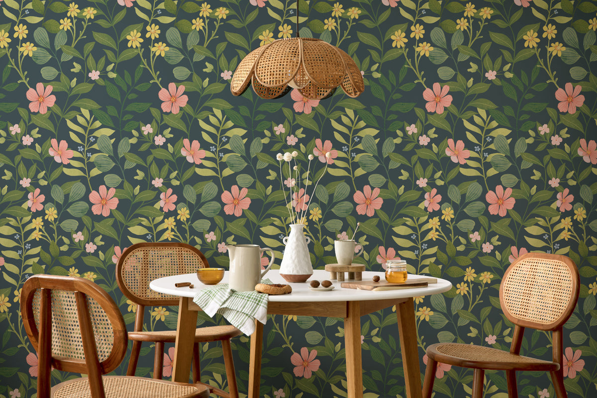 The Dusk Rosarium wallpaper in forest green and blush behind a dining table