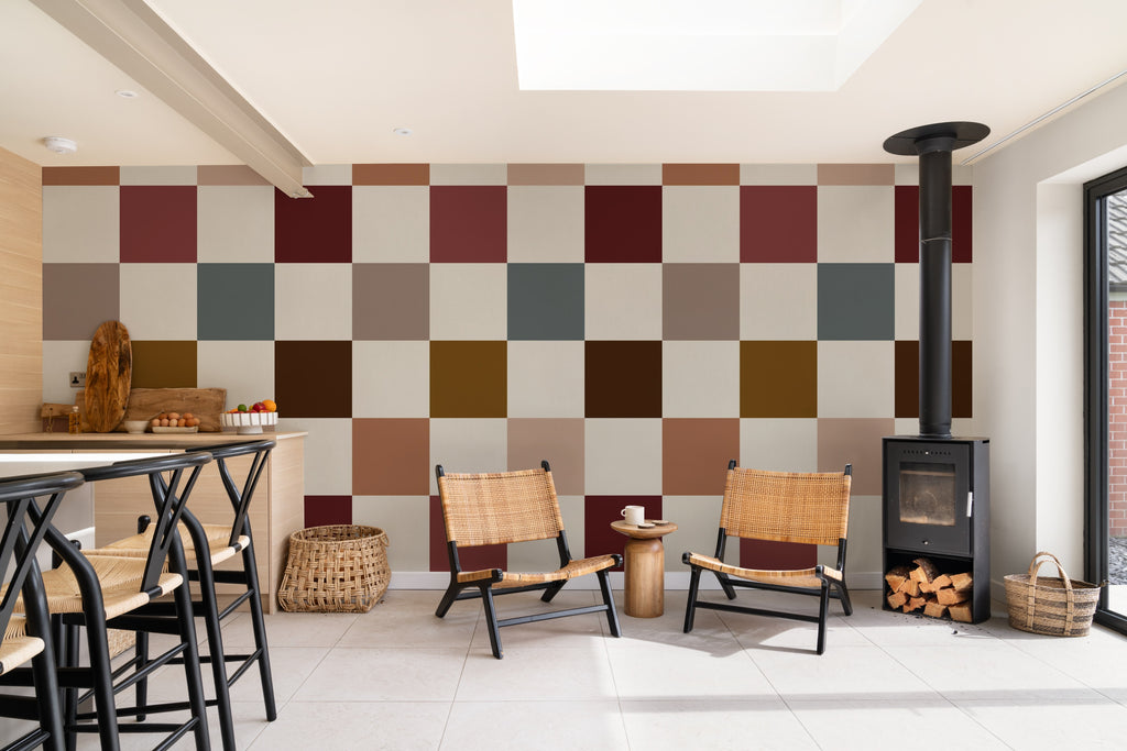 The Earthen Patchwork mural in clay and chocolate behind a dining table