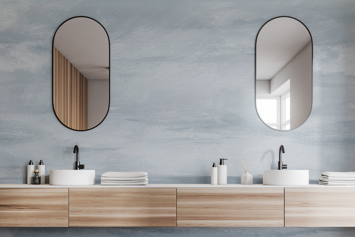 The Estuary Reverie mural in hazy blue in a styled room setting