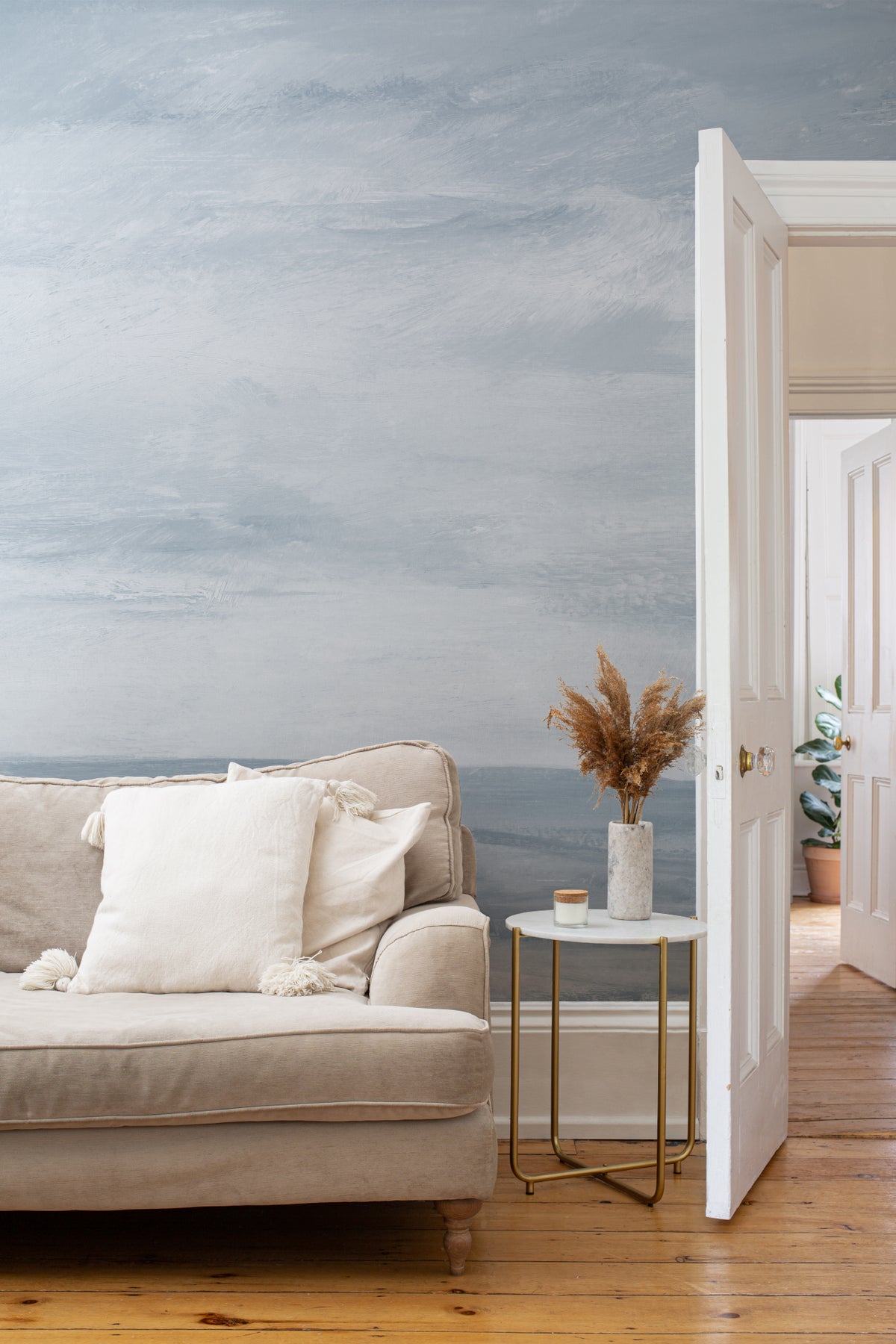 The Estuary Reverie mural in hazy blue in a living room