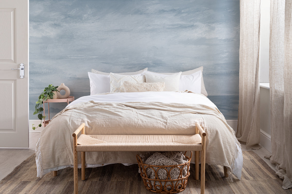 The Estuary Reverie mural in hazy blue behind the bed in a bedroom