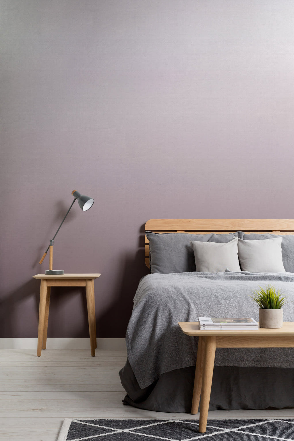 The Evening Veil mural in deep plum behind the bed in a bedroom