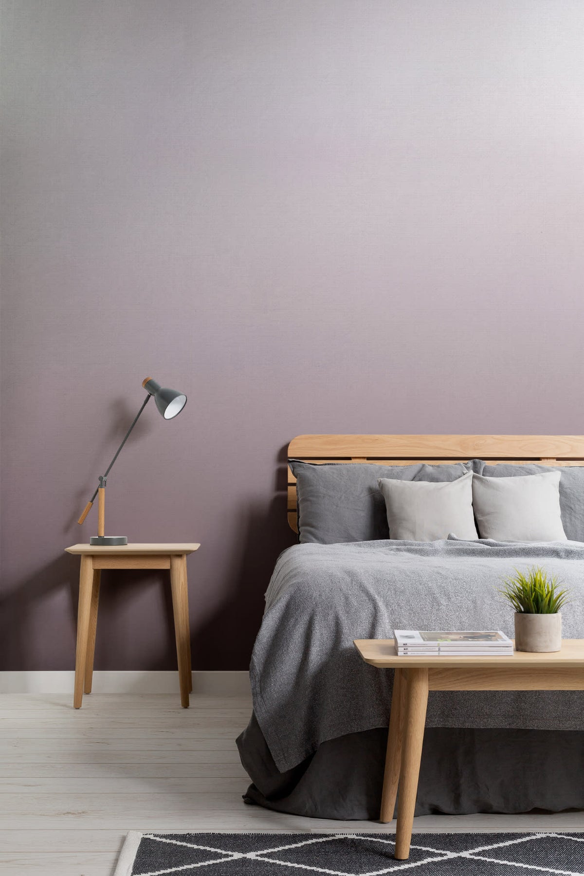 The Evening Veil mural in deep plum behind the bed in a bedroom