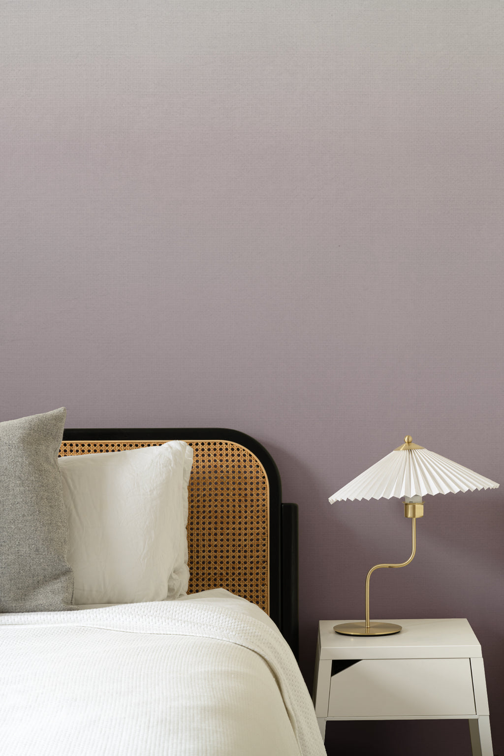 The Evening Veil mural in deep plum behind a styled console