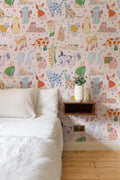 The Feline Wardrobe mural in candy pink on a nursery wall