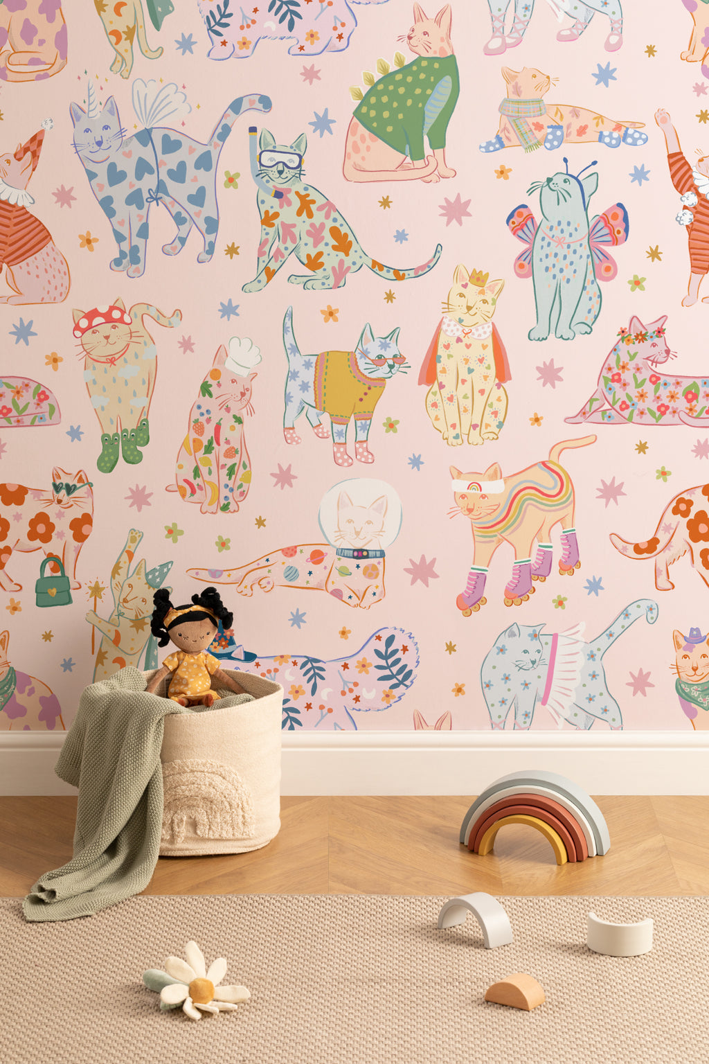 The Feline Wardrobe mural in candy pink in a children's room setting, another angle