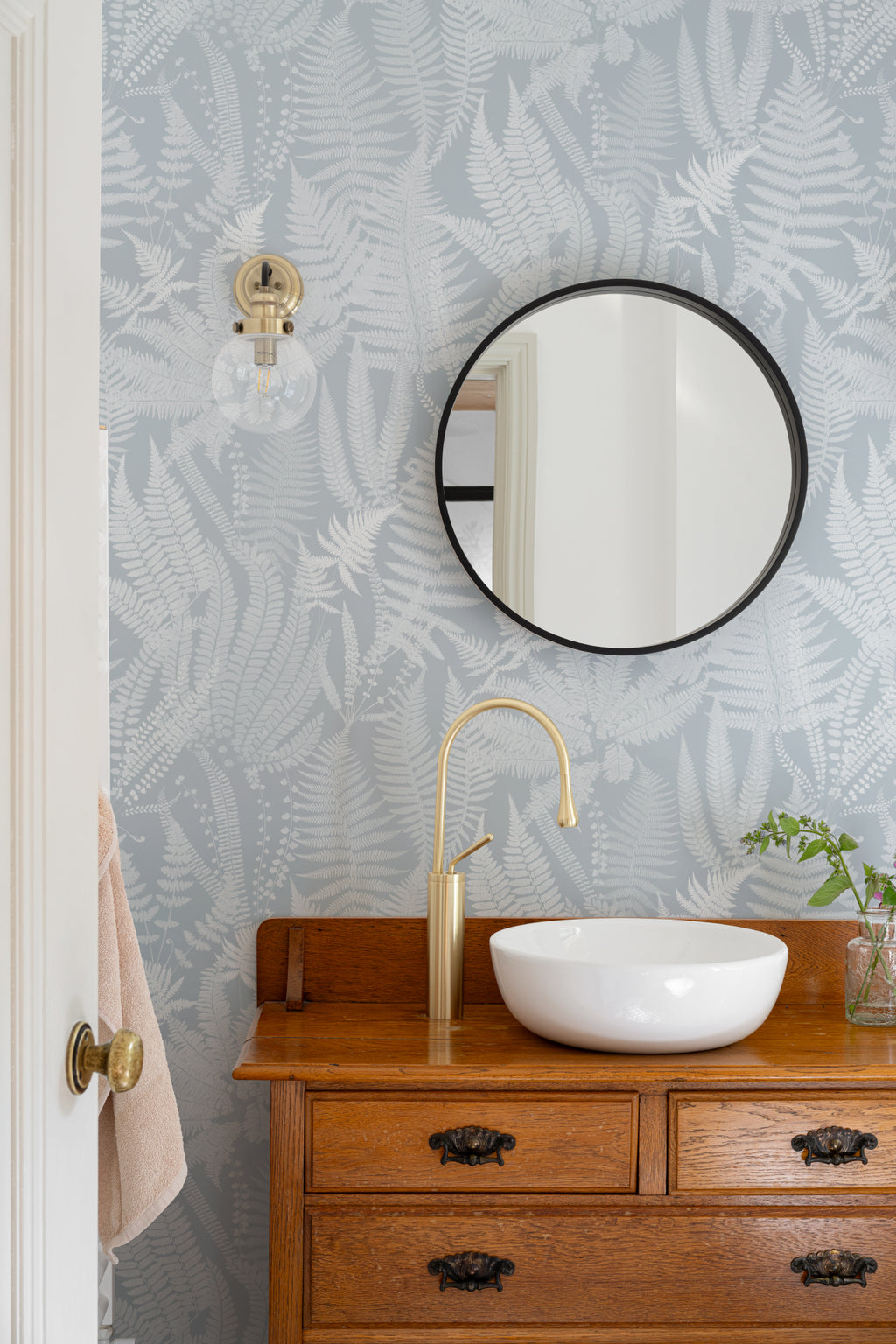 The Fernery Study wallpaper in duck egg blue in a bathroom