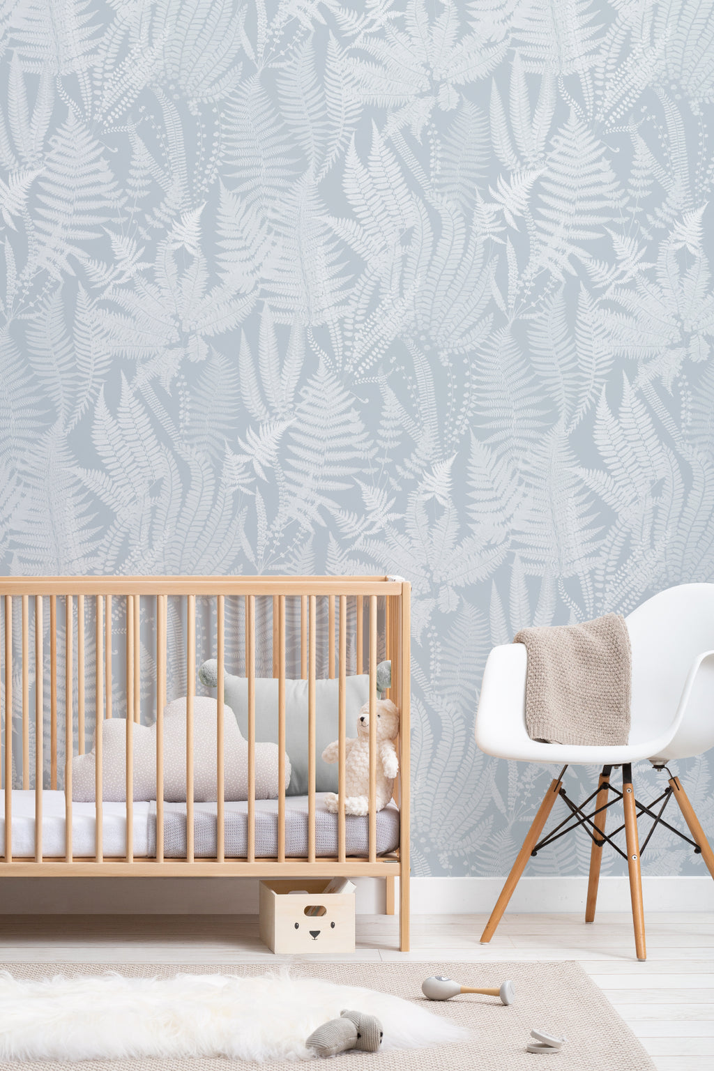 The Fernery Study wallpaper in duck egg blue on a nursery wall