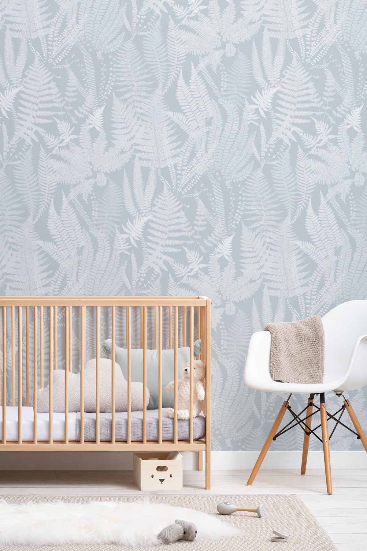 The Fernery Study wallpaper in duck egg blue on a nursery wall