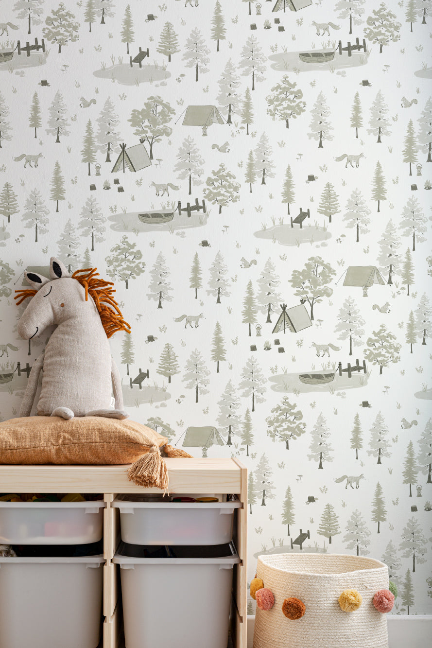 The Firelight Woods wallpaper in sage green in a child's bedroom