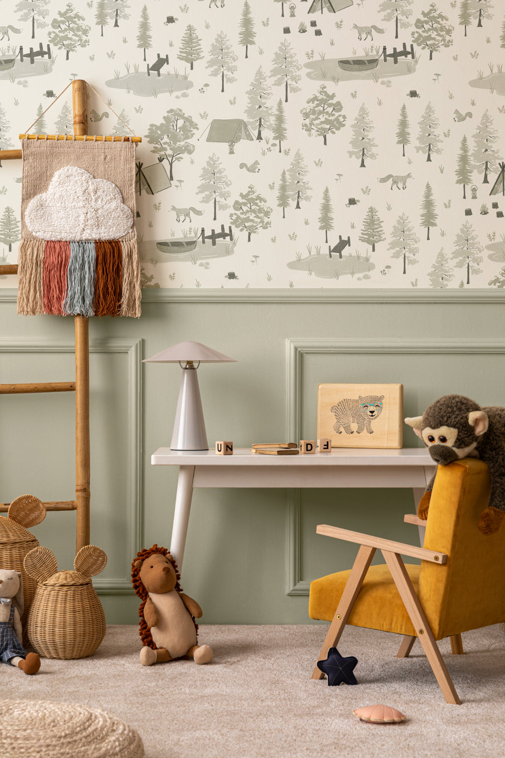 The Firelight Woods wallpaper in sage green behind a kids' play corner