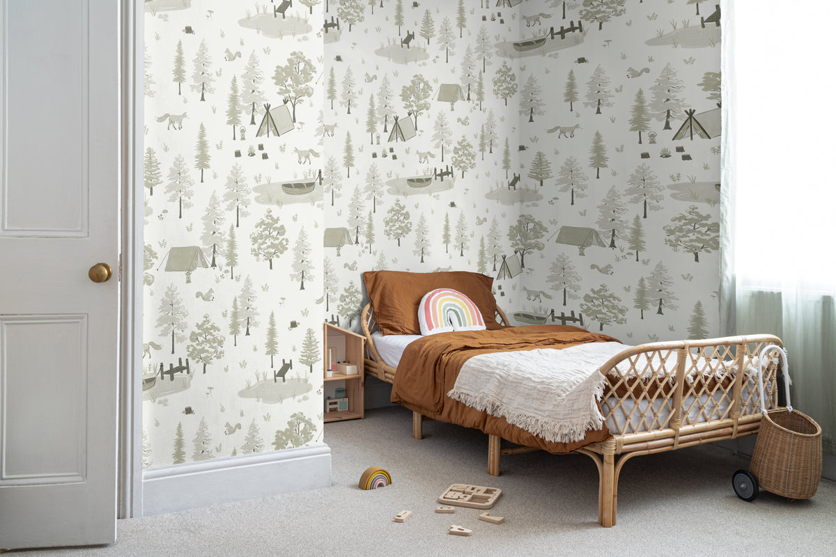 The Firelight Woods wallpaper in sage green in a children's room setting