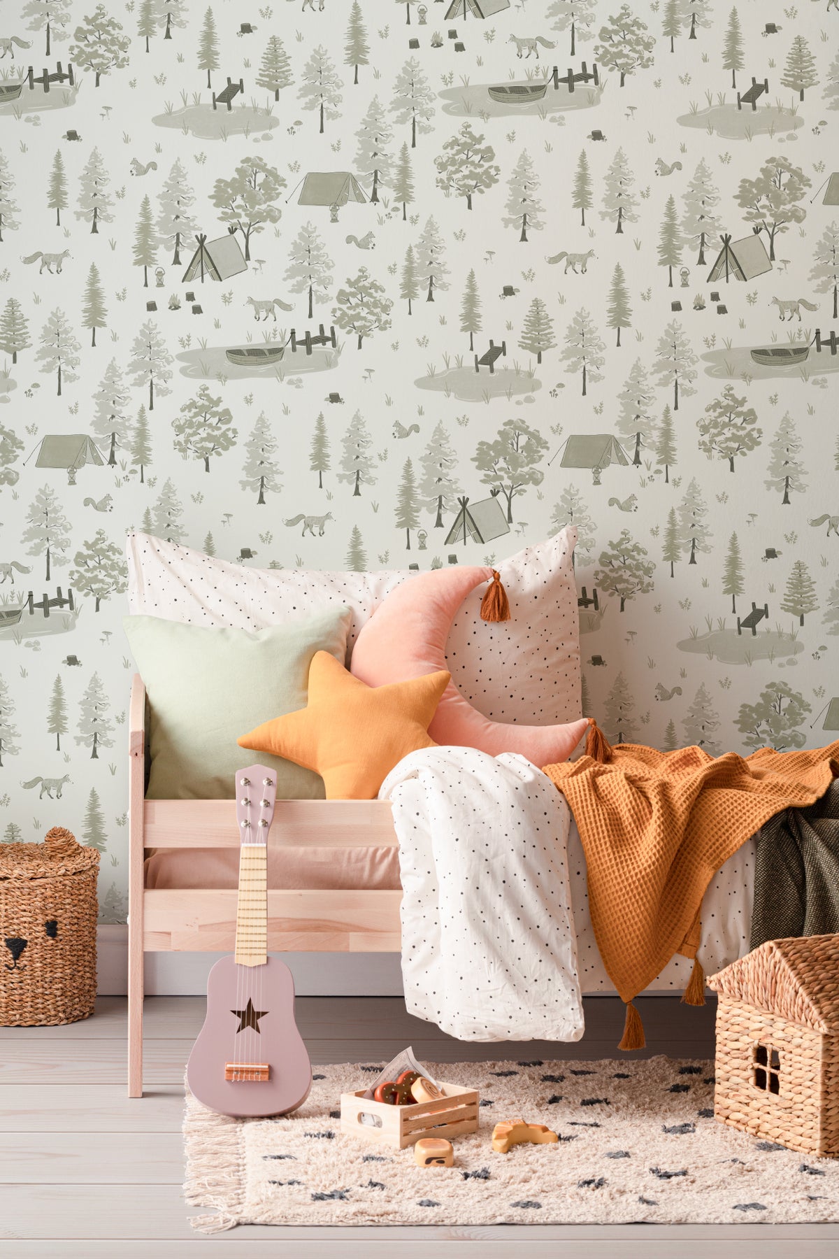 The Firelight Woods wallpaper in sage green in a children's room setting, view 3