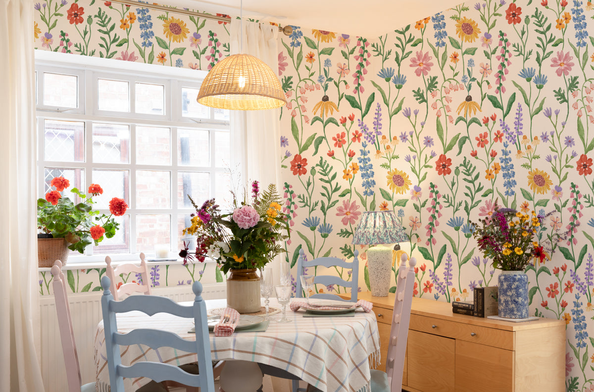 The Flower Almanac mural in cornflower and poppy on a nursery wall