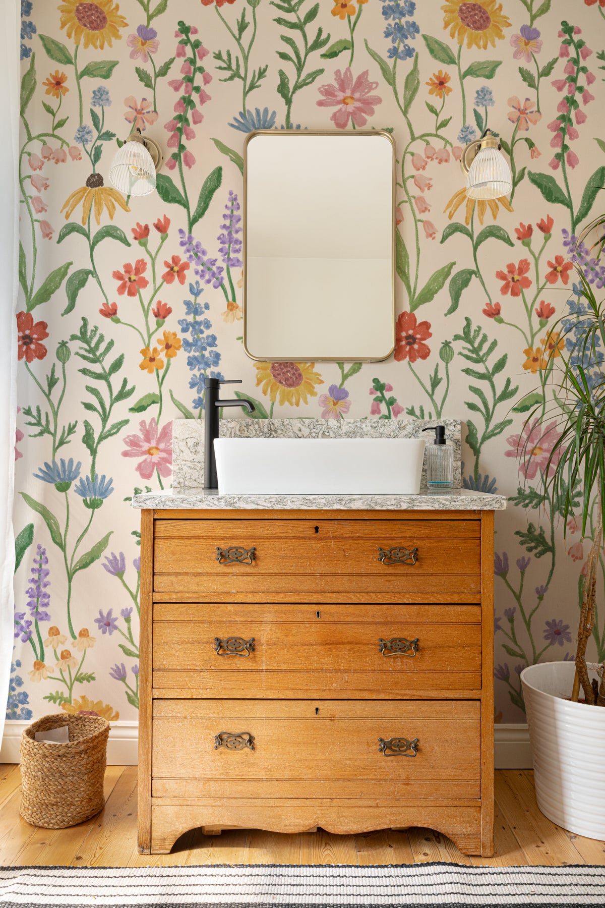 The Flower Almanac mural in cornflower and poppy in a child's bedroom