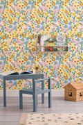 The Flower Market wallpaper in sunshine yellow on a nursery wall