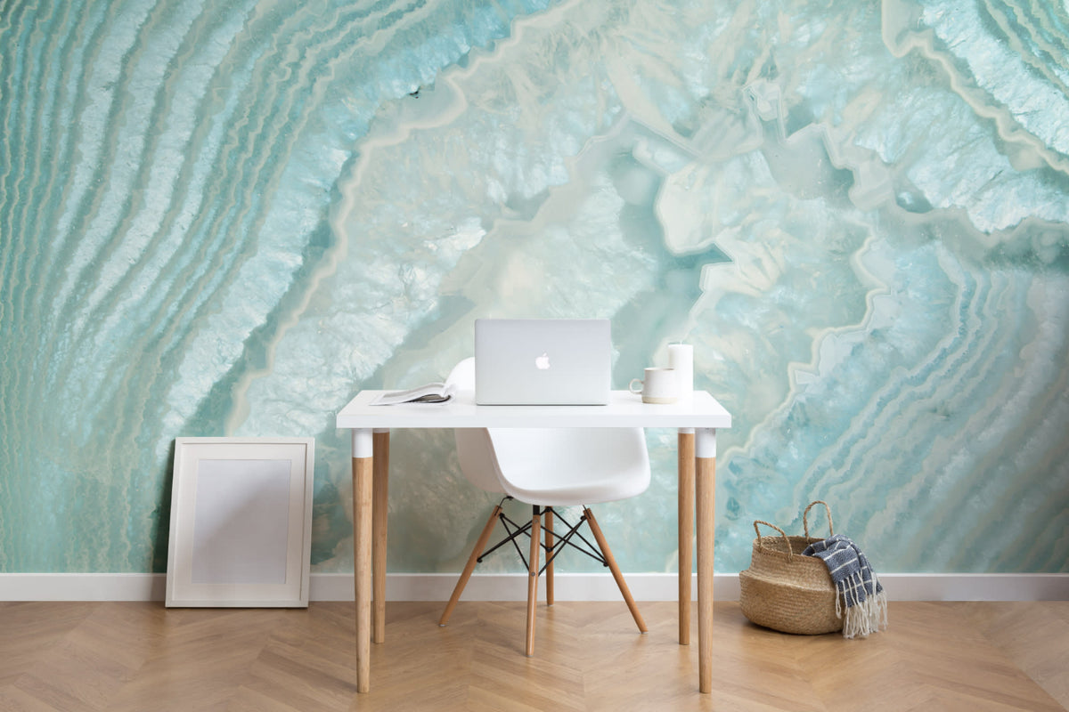 The Geode Salon mural in aquamarine behind a desk in a home office