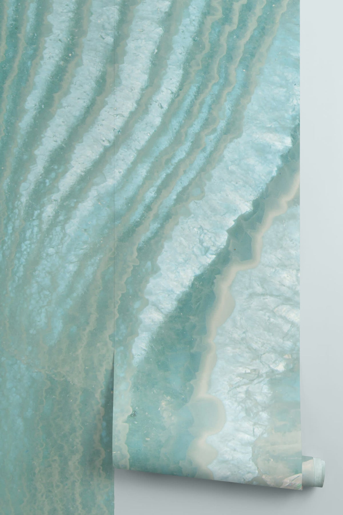 Rolled panel of The Geode Salon mural in aquamarine