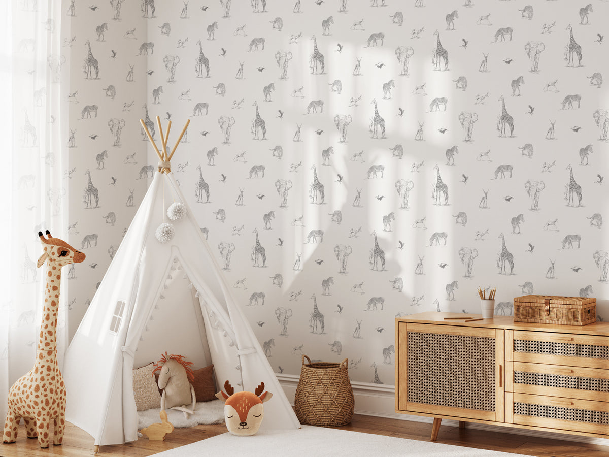 The Grassland Expedition wallpaper in dove grey and white on a nursery wall