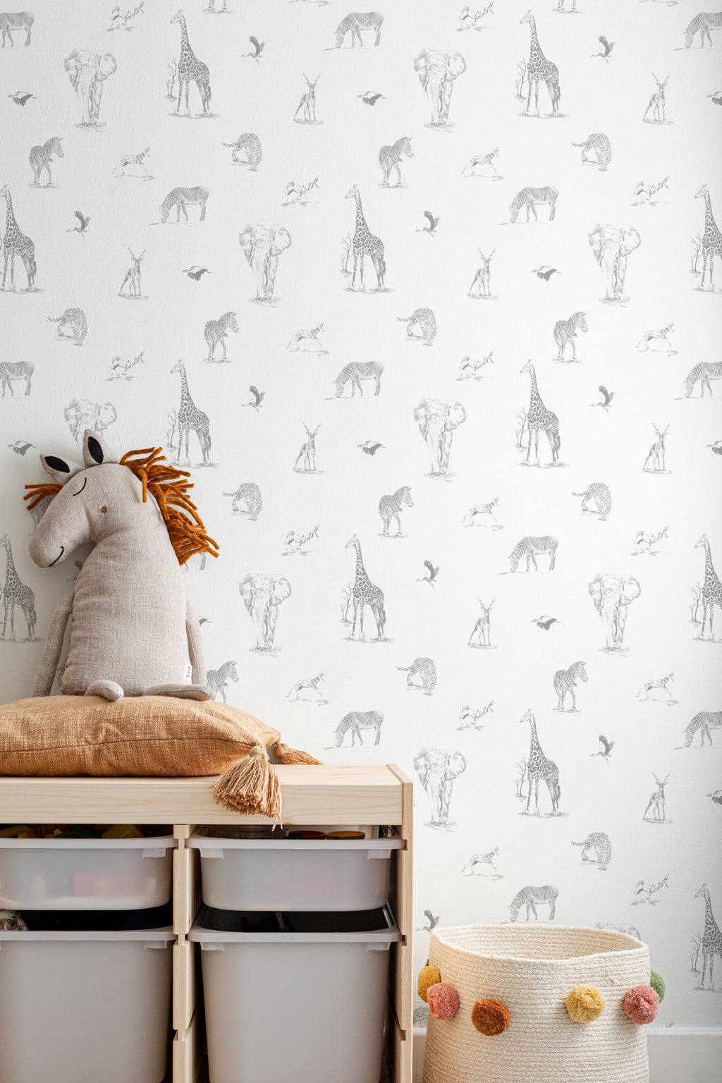 The Grassland Expedition wallpaper in dove grey and white in a children's room setting