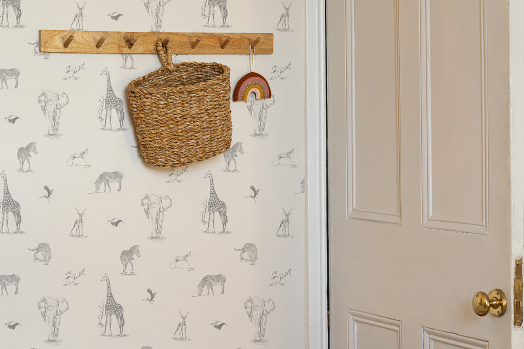 The Grassland Expedition wallpaper in dove grey and white in a hallway