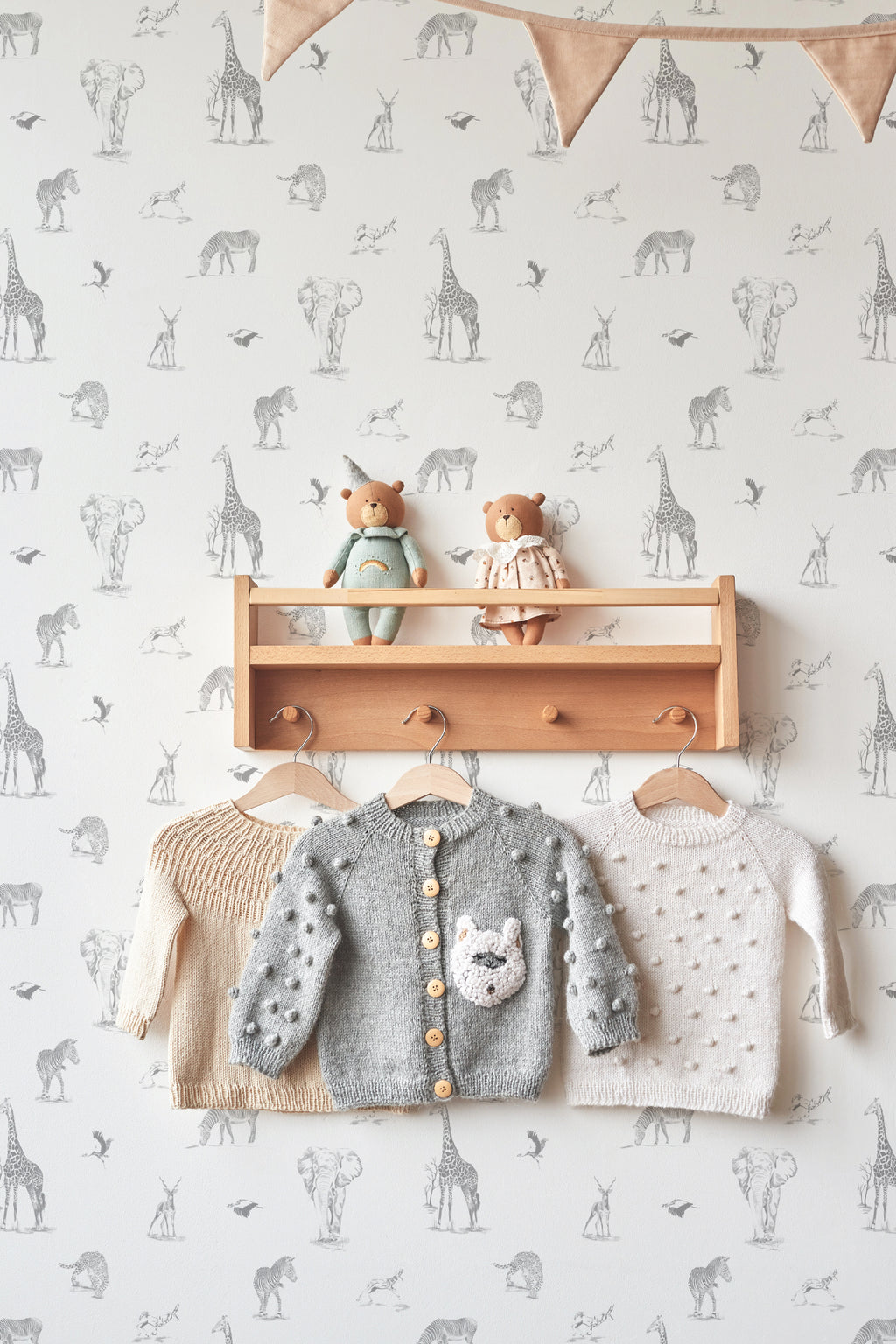 The Grassland Expedition wallpaper in dove grey and white in a children's room setting, another angle