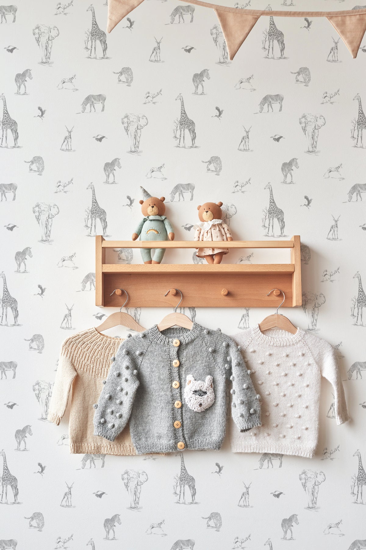 The Grassland Expedition wallpaper in dove grey and white in a children's room setting, another angle