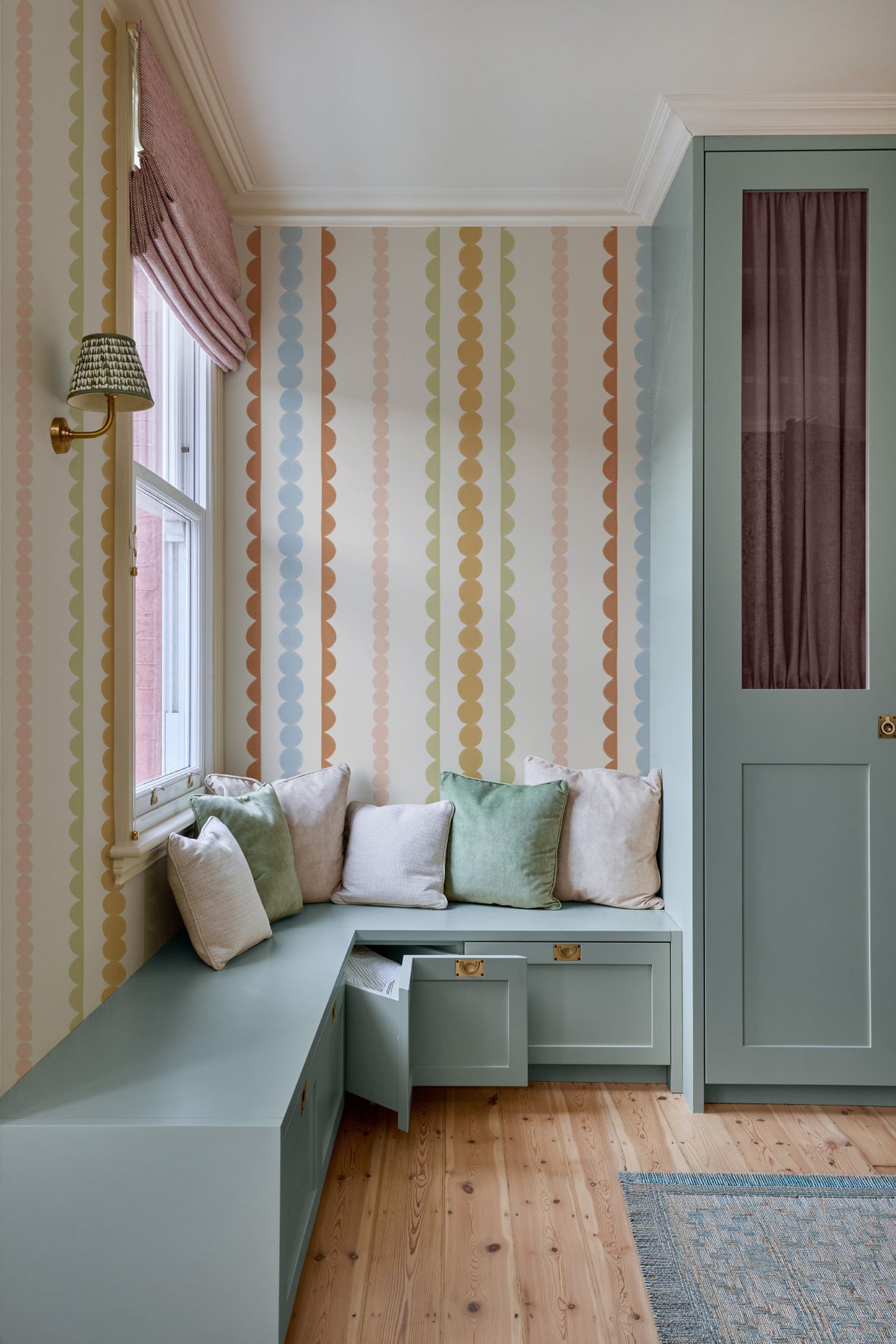 The Haberdashery Braid mural in apricot and pink in a child's bedroom