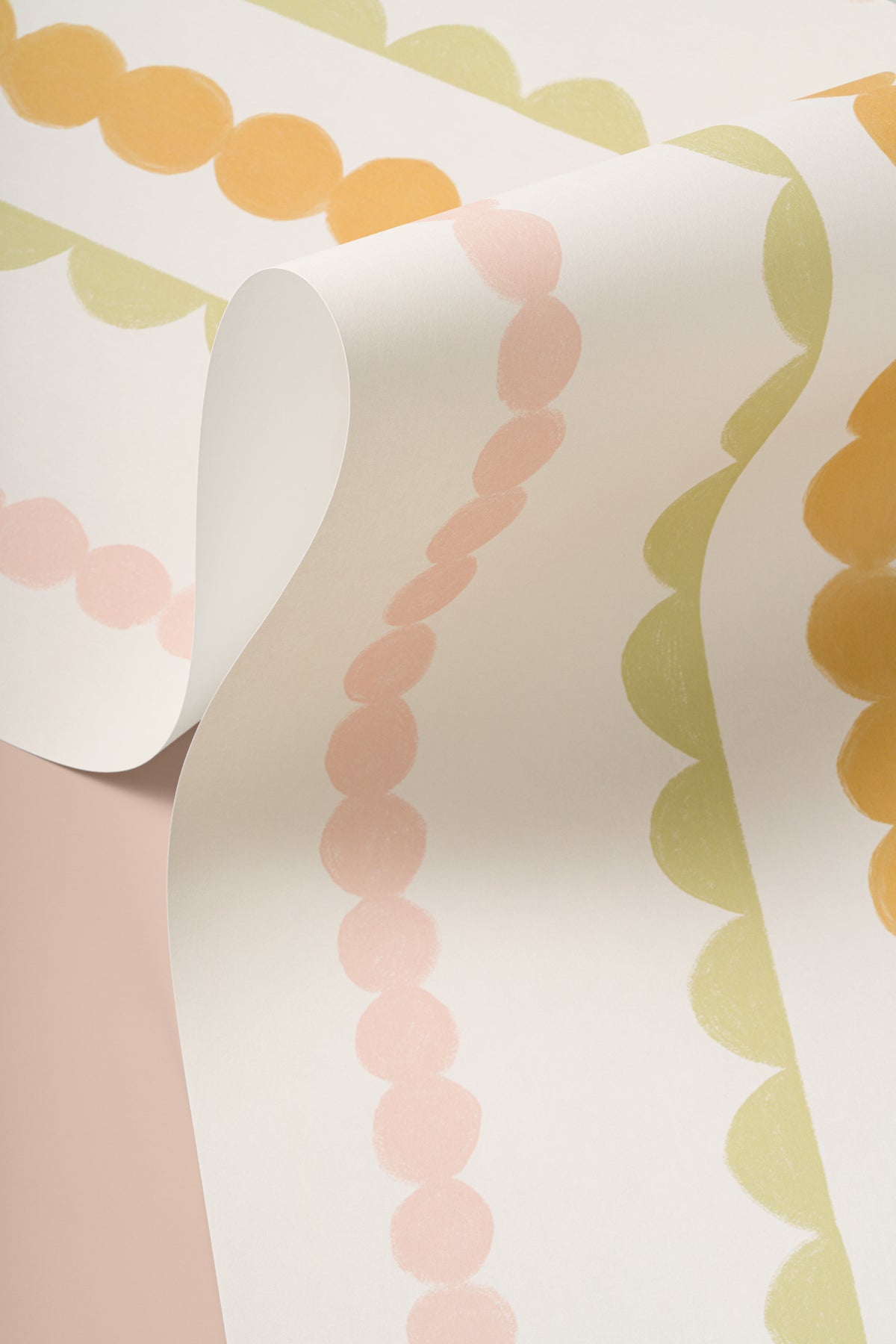 Angled detail of The Haberdashery Braid mural in apricot and pink