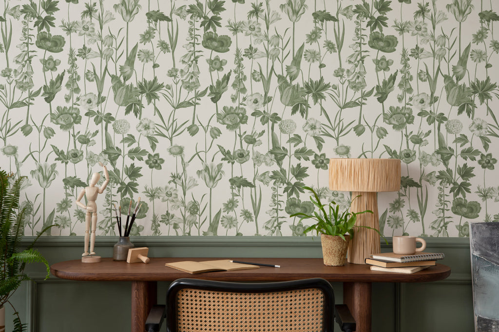 The Hedgerow Botanica wallpaper in fern green and white behind a desk in a home office