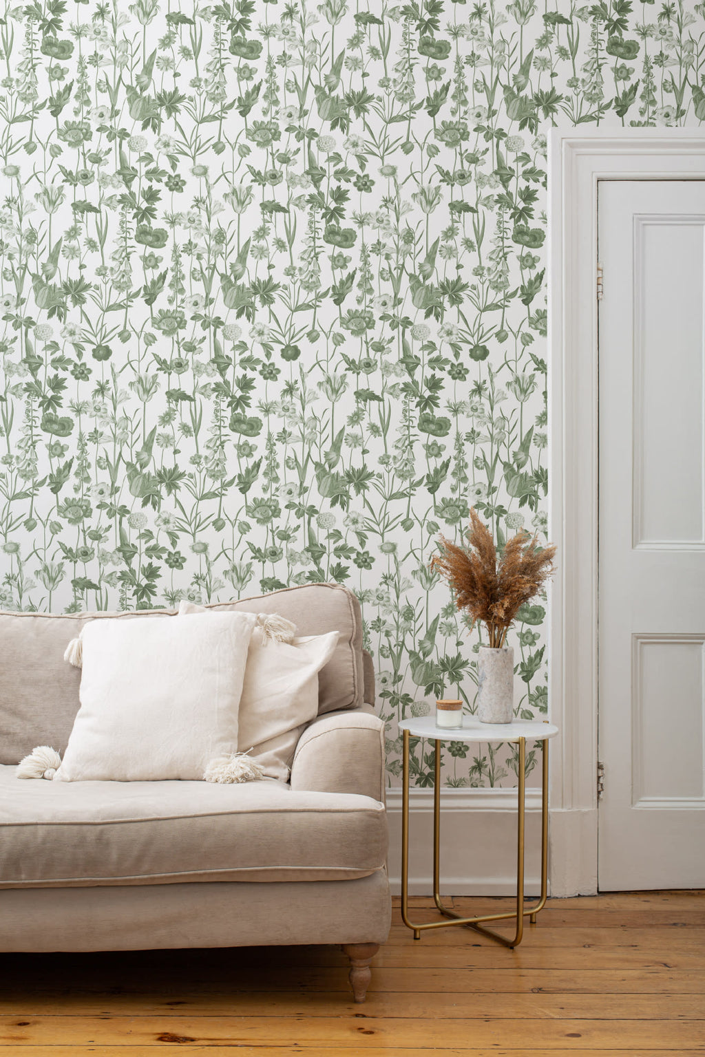 The Hedgerow Botanica wallpaper in fern green and white in a living room