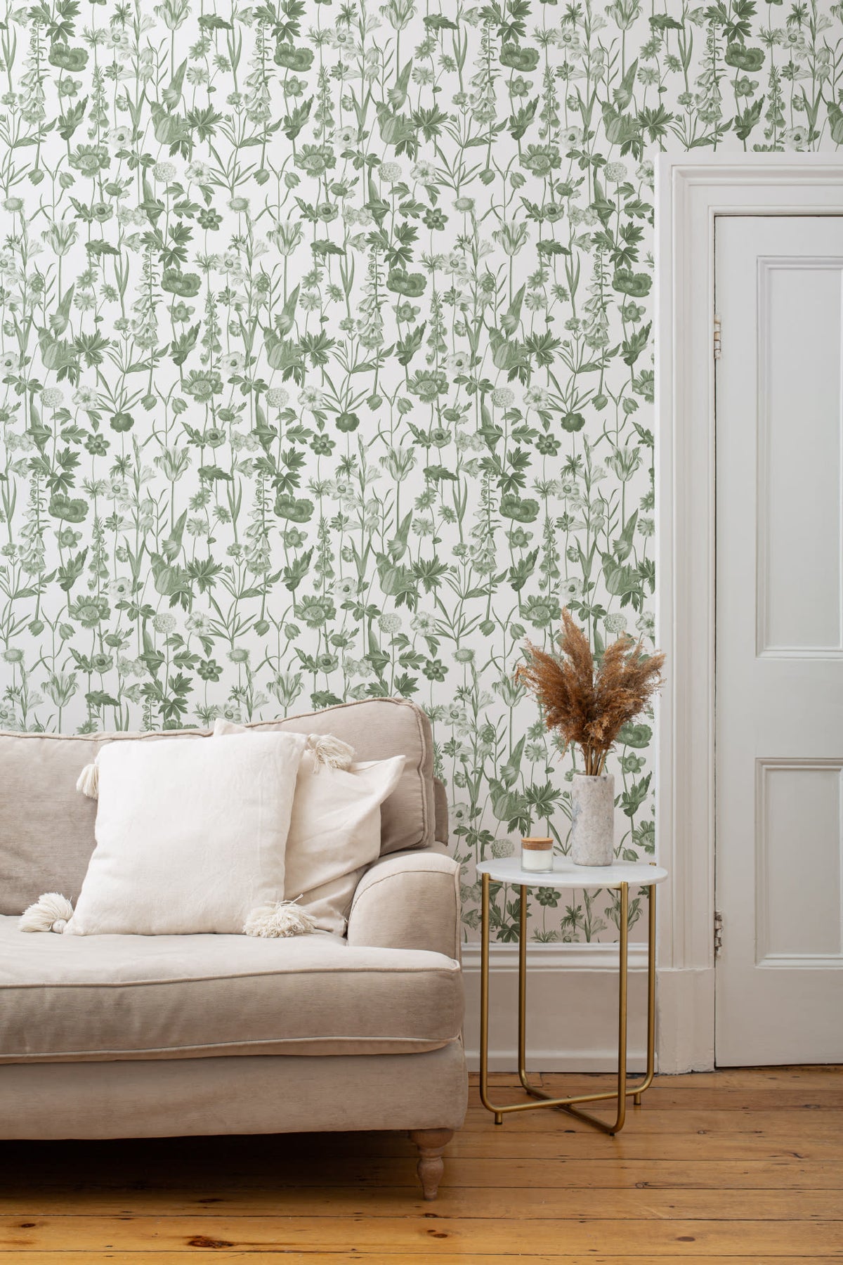 The Hedgerow Botanica wallpaper in fern green and white in a living room