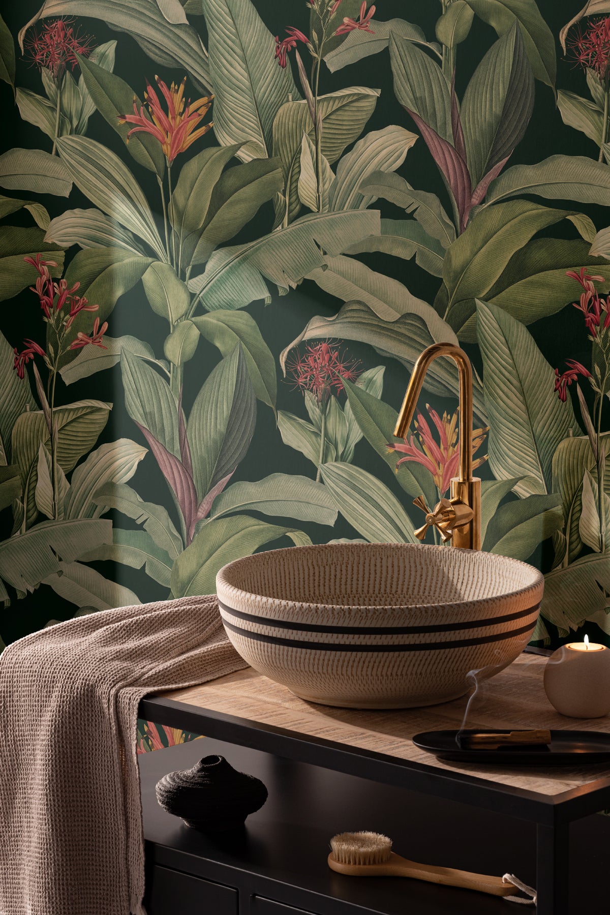 The Heliconia Hall wallpaper in deep jungle green behind seating in a living room