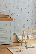 The Herbarium Press wallpaper in mist blue on a nursery wall