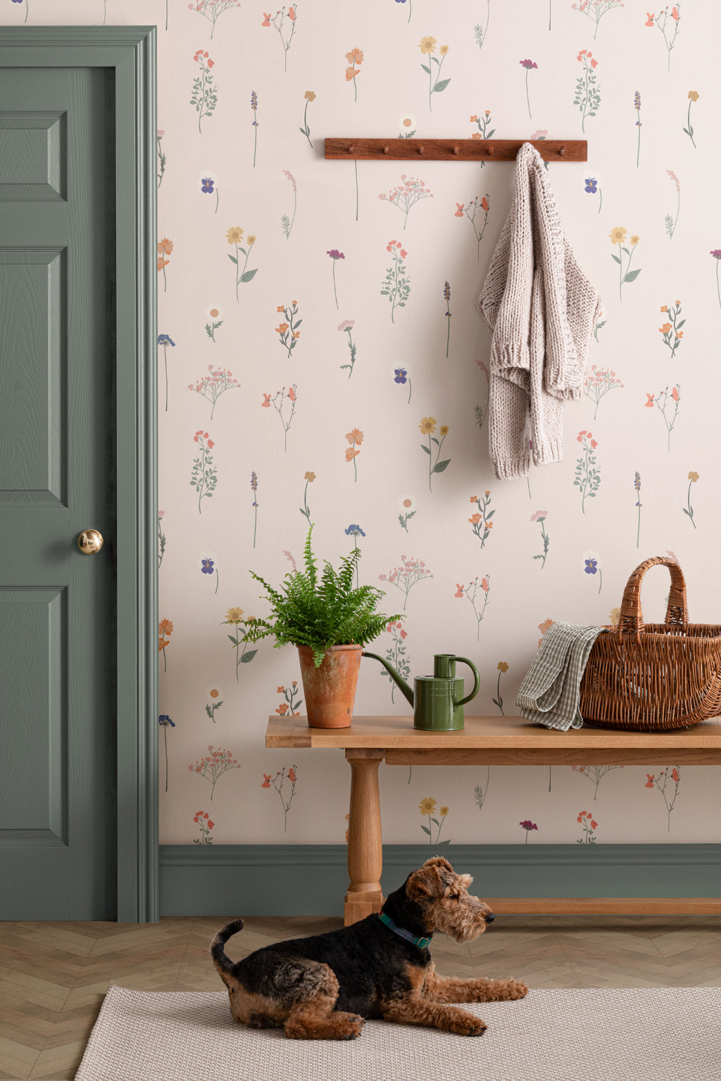 The Herbarium Press wallpaper in soft blush in a hallway