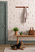 The Herbarium Press wallpaper in soft blush in a hallway
