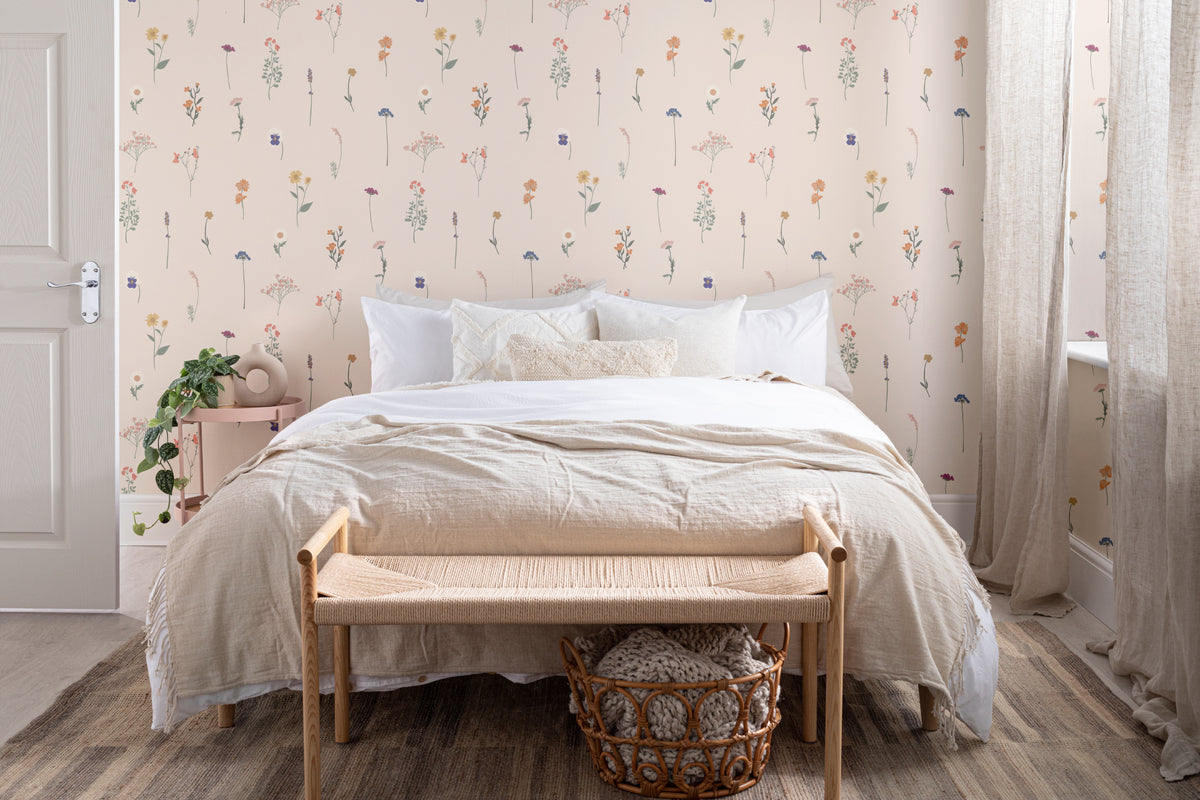 The Herbarium Press wallpaper in soft blush in a calm bedroom setting