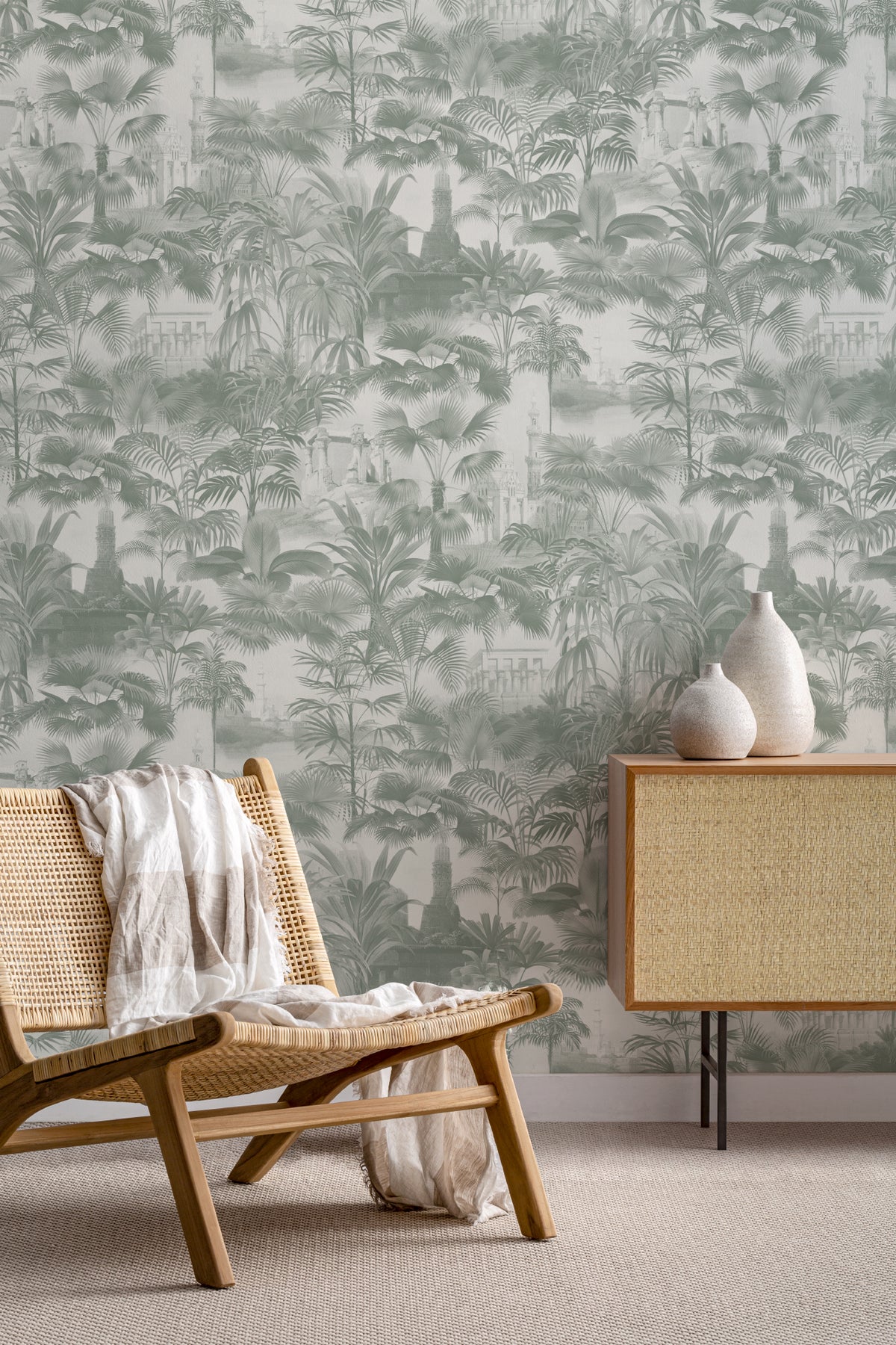 The Hidden Pavilion wallpaper in eucalyptus green behind seating in a living room