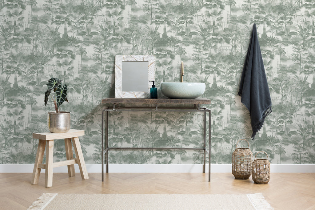 The Hidden Pavilion wallpaper in eucalyptus green as a backdrop to styled furniture