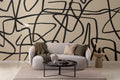 The Ink Gesture mural in black and parchment in a living room