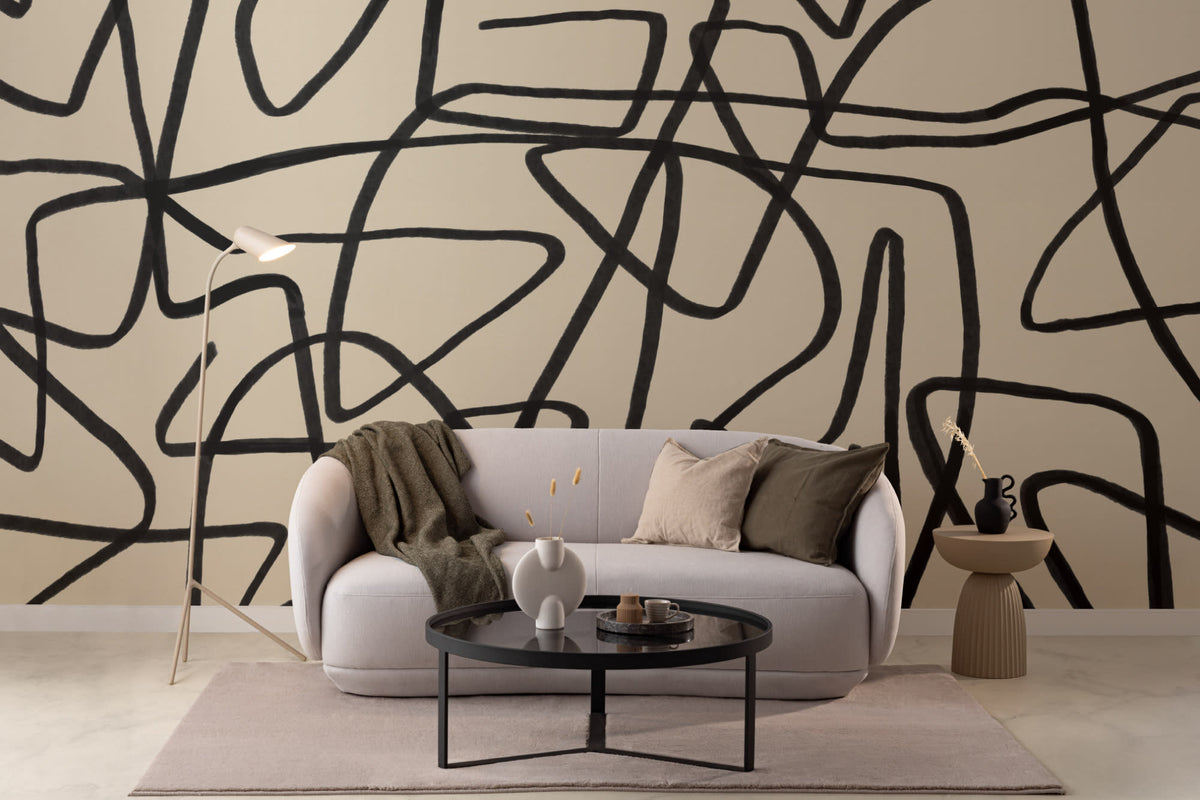 The Ink Gesture mural in black and parchment in a living room