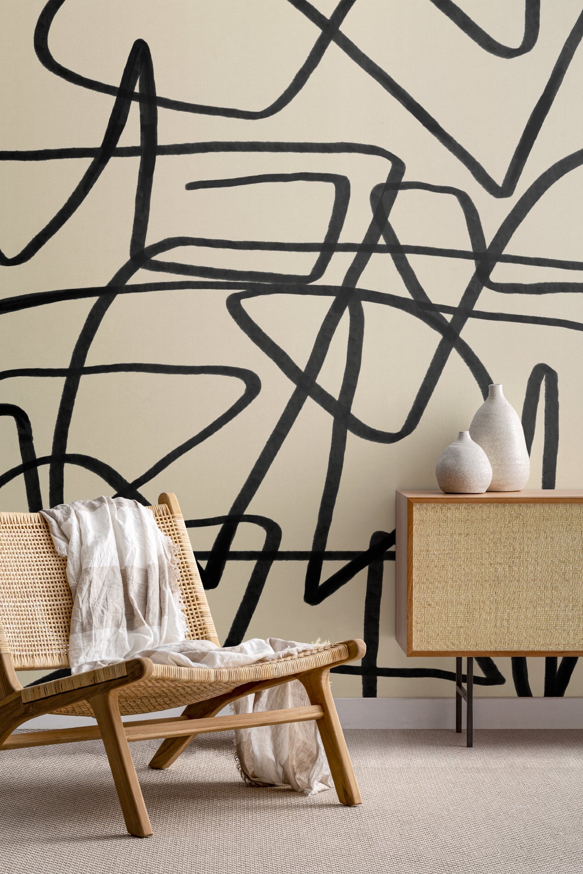 The Ink Gesture mural in black and parchment in a study corner with a desk
