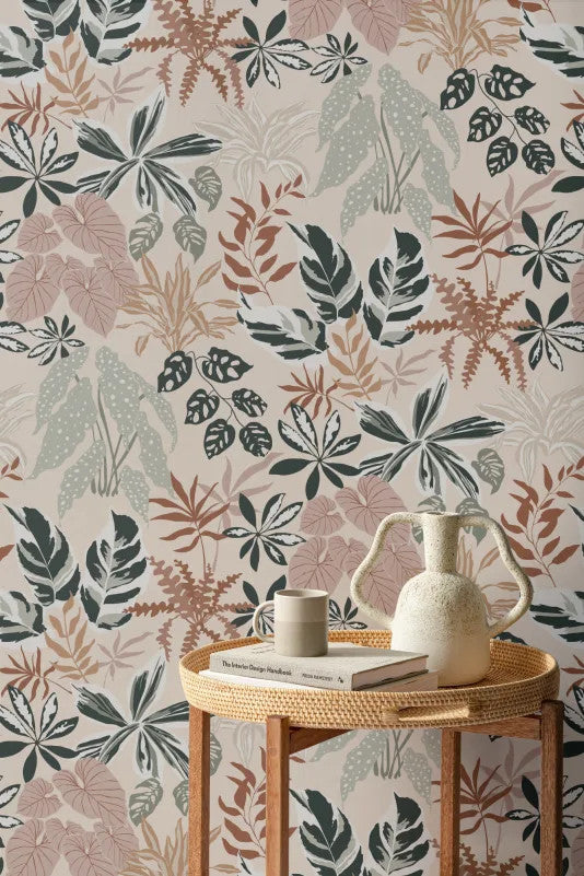 The Leafy Solarium wallpaper in warm sand and pine behind a styled console